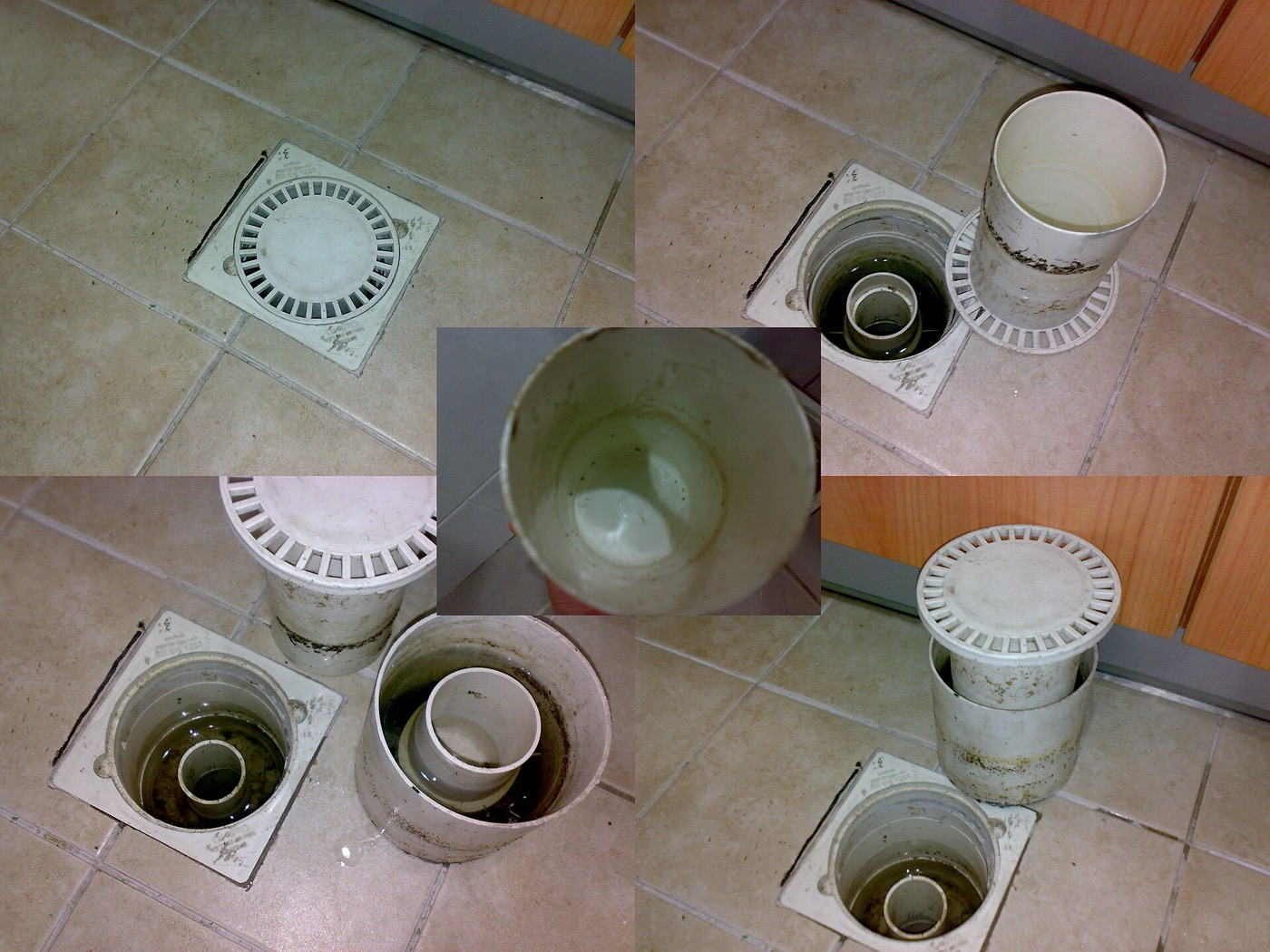 Floor trap with its grating and inner cup removed for cleaning.