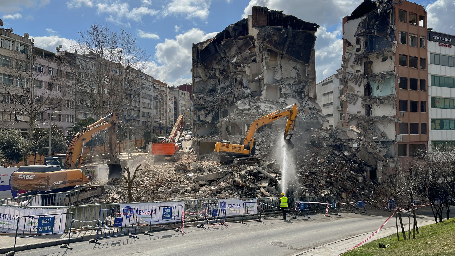 Demolition works with heavy machinery and building debris