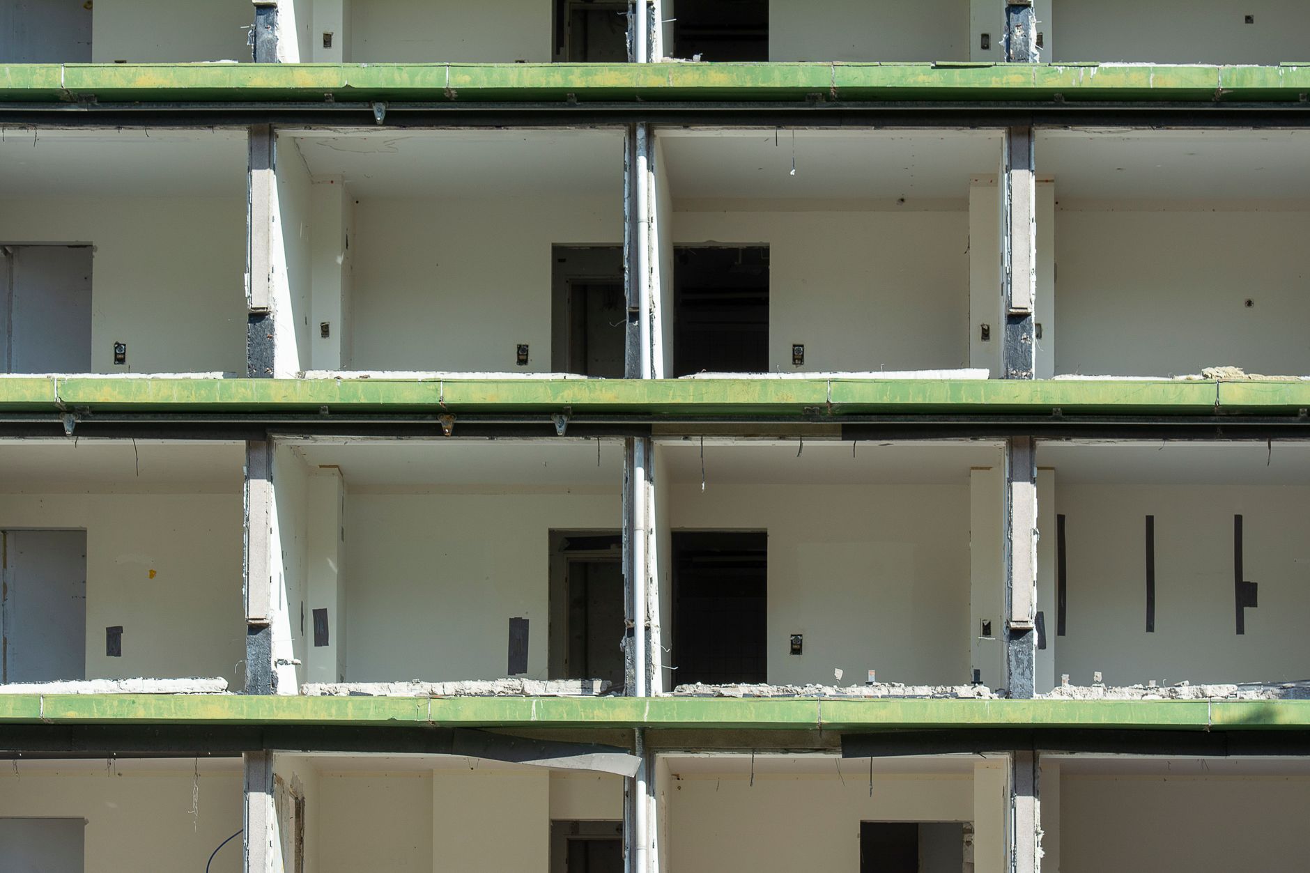 Partially demolished walls with exposed concrete