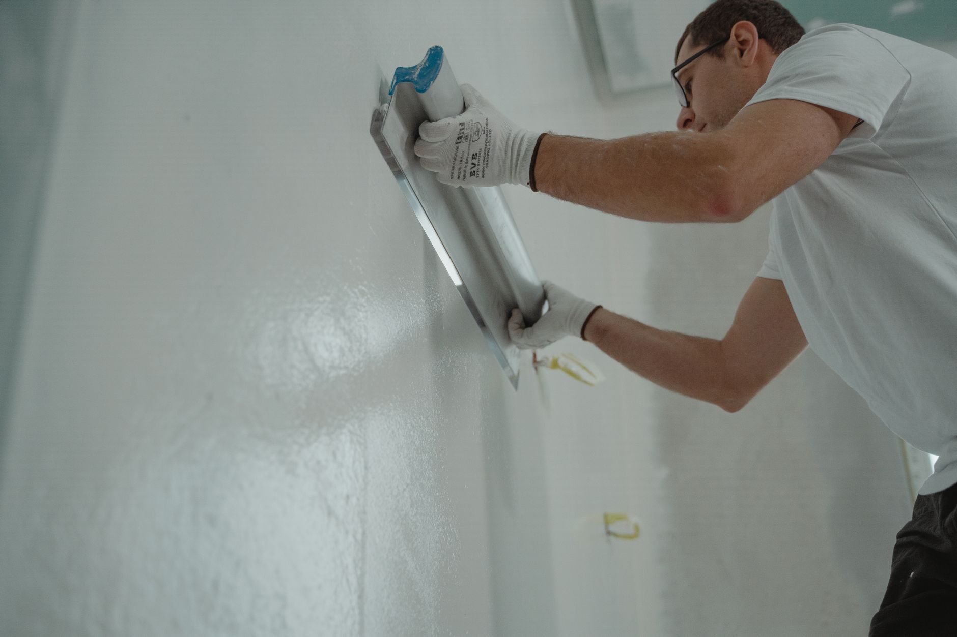 Applying plaster to an interior wall for a smooth finish